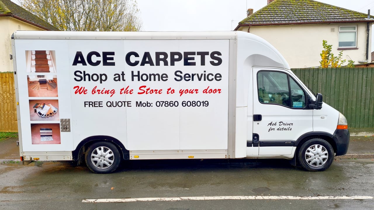 The Ace Carpets mobile showroom van parked outside a customer's home
